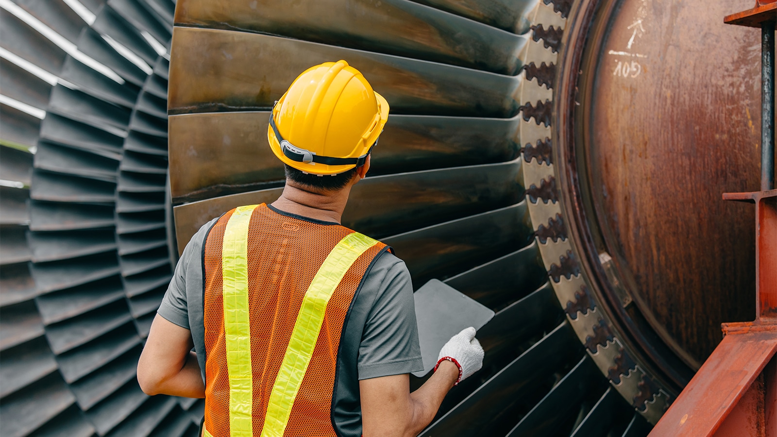 Engineer Inspecting Turbine Blades